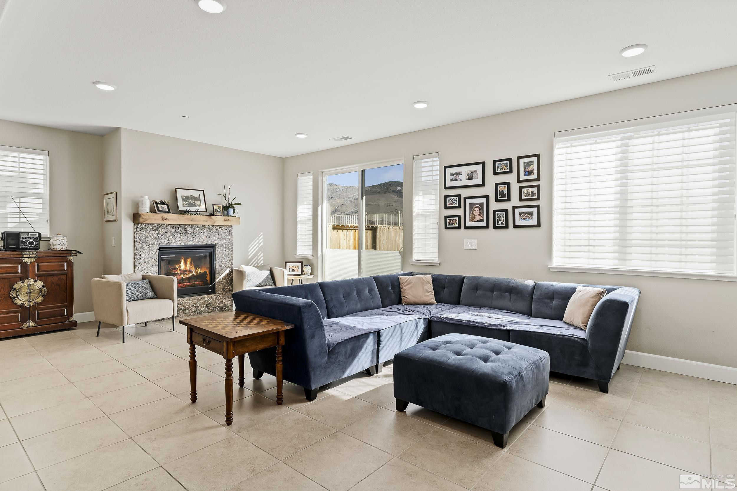 1820 Dark Horse Road Reno, NV 89521 - Photo 5 of 21 a living room with furniture and a fireplace