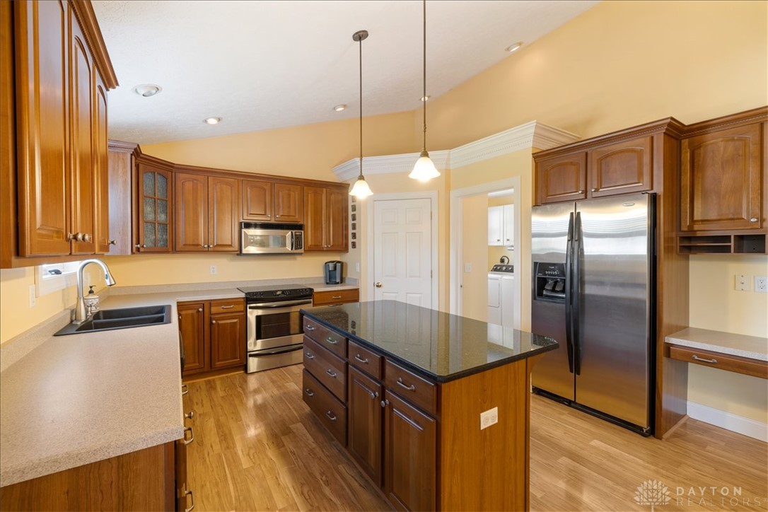 841 Willow Road Springfield, OH 45502 - Photo 9 of 64 This spacious kitchen offers ample cabinetry, modern appliances, and a functional island for culinary pursuits.