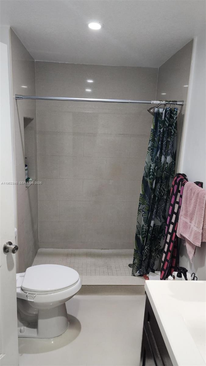 13337 Southwest 112th Place Miami, FL 33176 - Photo 4 of 14 a bathroom with a sink toilet and shower