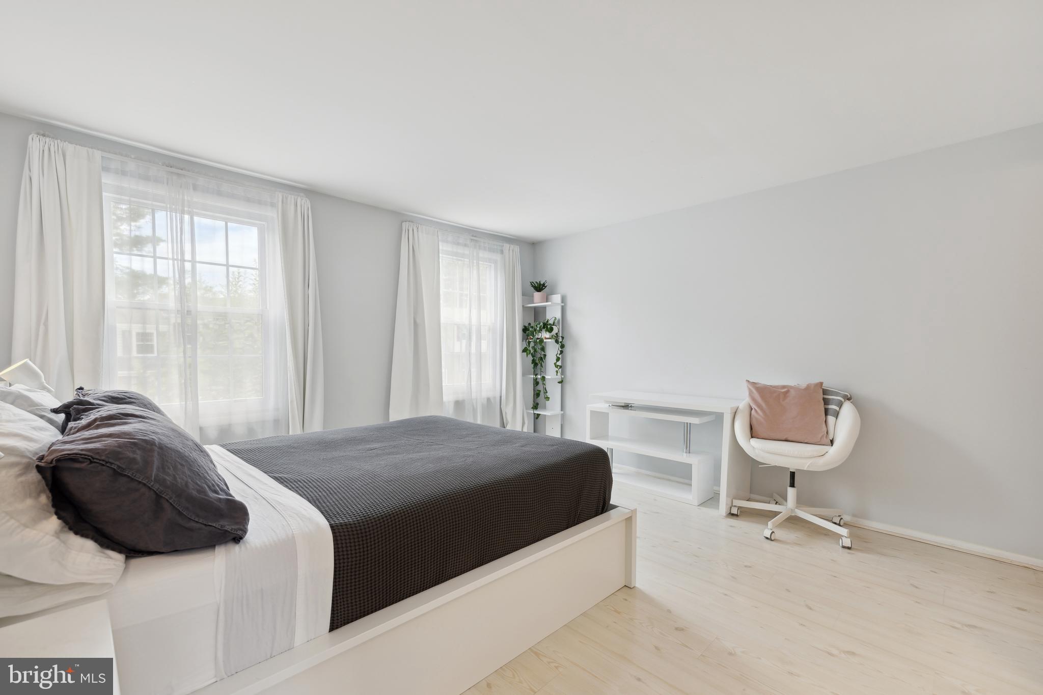 17680 Kohlhoss Road Poolesville, MD 20837 - Photo 12 of 30 a bedroom with a bed and a chair