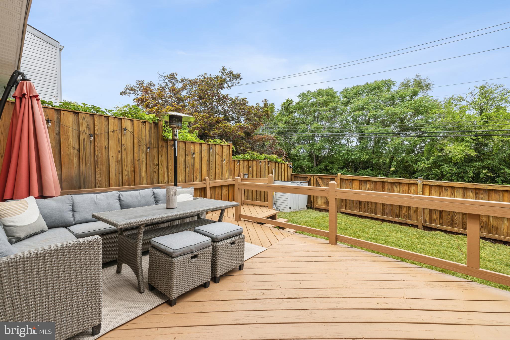 17680 Kohlhoss Road Poolesville, MD 20837 - Photo 24 of 30 a roof deck with couches and wooden floor