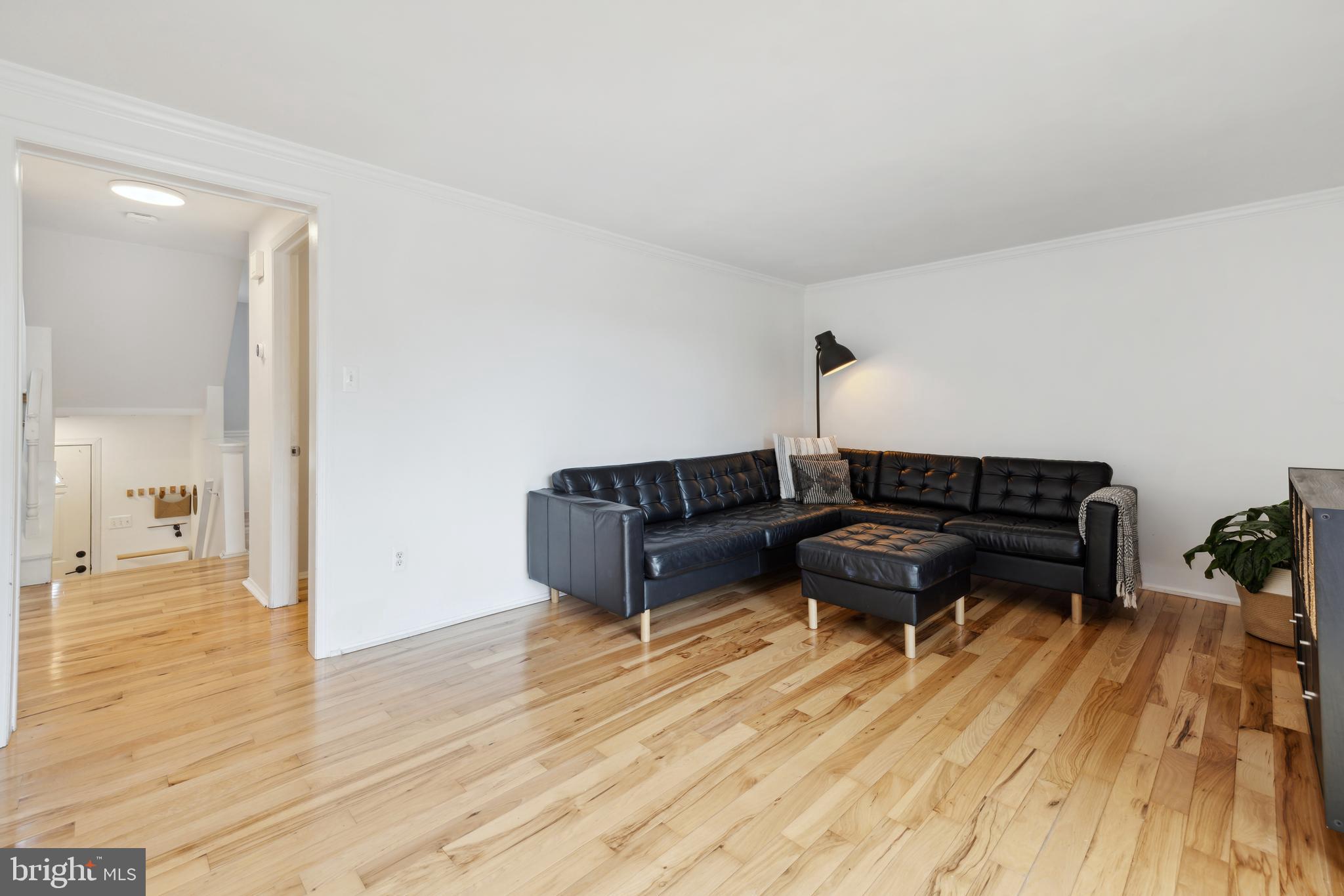 17680 Kohlhoss Road Poolesville, MD 20837 - Photo 8 of 30 a living room with couch and a wooden floor