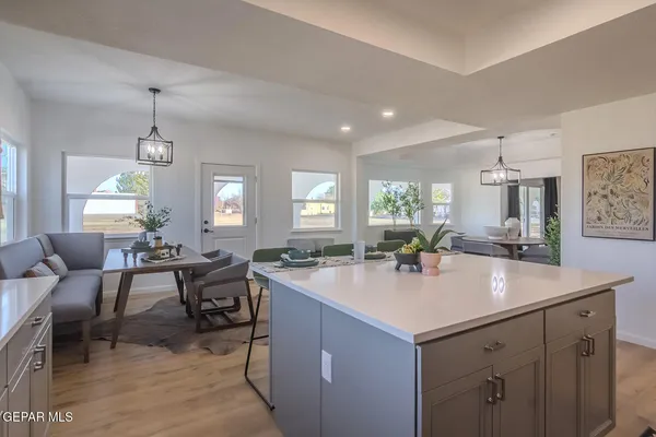 a view of livingroom with hardwood floor and a sink