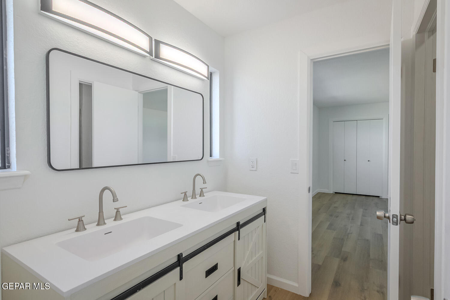 4 Cielo Del Este Anthony, NM 88021 - Photo 71 of 90 a bathroom with a sink vanity and a mirror