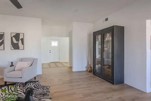 a view of hallway with wooden floor