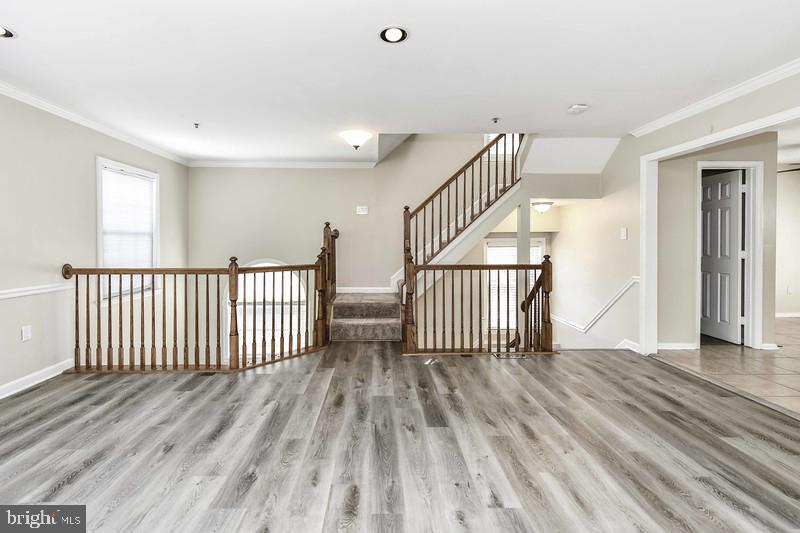 2 Parker Farm Court Silver Spring, MD 20906 - Photo 17 of 34 a view of a hallway with wooden floor and windows