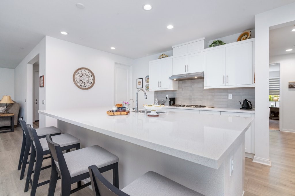 32250 Olea Way Temecula, CA 92591 - Photo 11 of 39 a large kitchen with a table and chairs