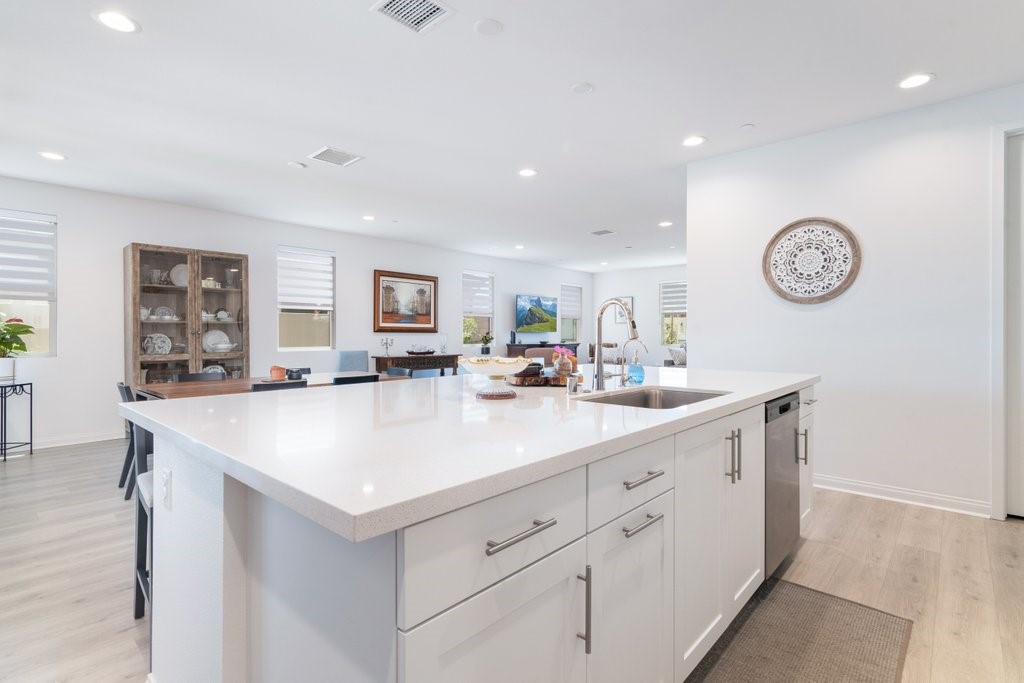 32250 Olea Way Temecula, CA 92591 - Photo 12 of 39 a view of kitchen with center island and living room