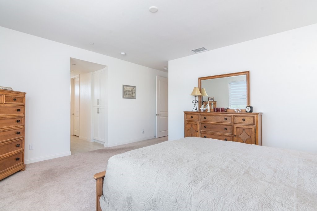 32250 Olea Way Temecula, CA 92591 - Photo 20 of 39 a bedroom with a bed and a dresser
