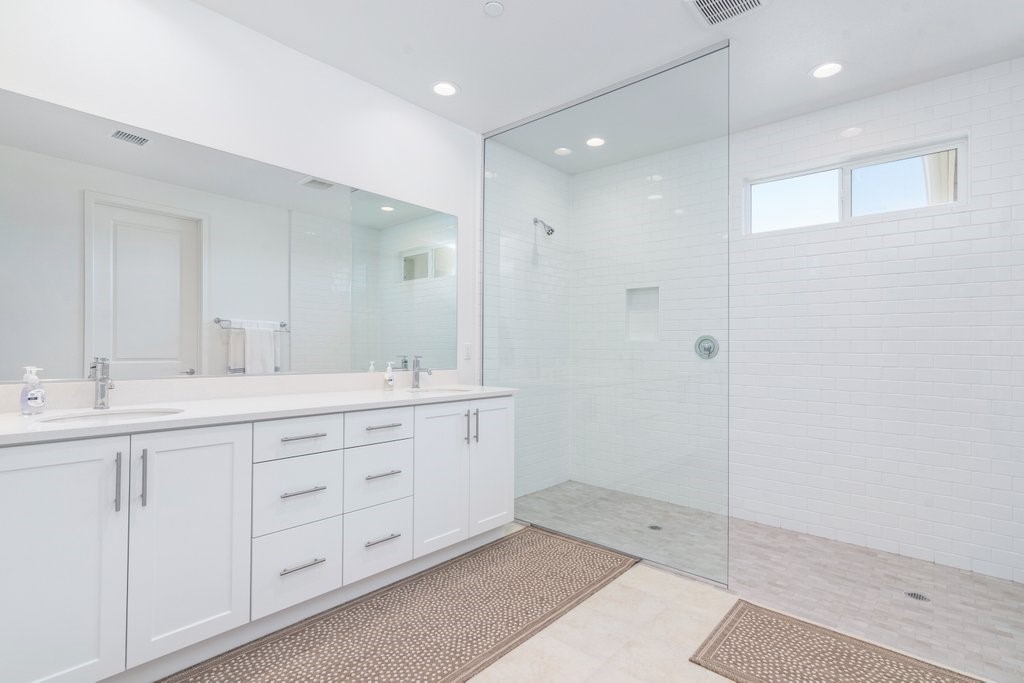 32250 Olea Way Temecula, CA 92591 - Photo 21 of 39 a bathroom with double sink and a mirror