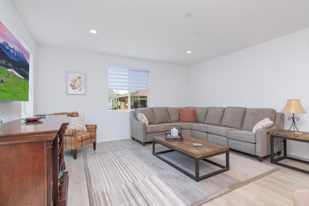 32250 Olea Way Temecula, CA 92591 - Photo 7 of 39 a living room with furniture and a wooden floor