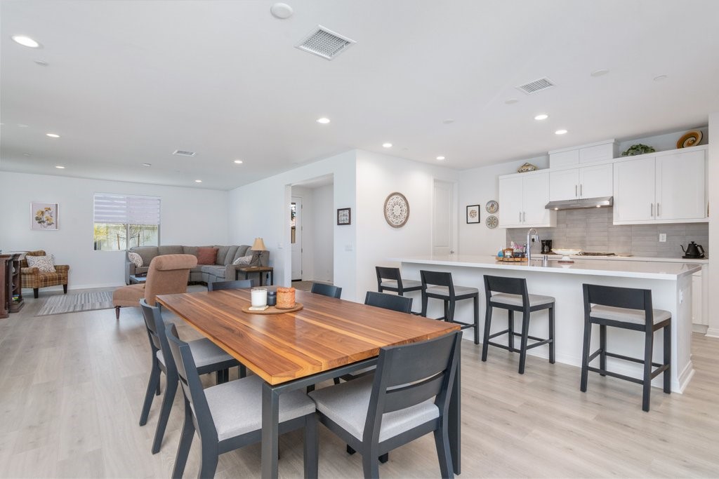 32250 Olea Way Temecula, CA 92591 - Photo 9 of 39 a view of kitchen with cabinets table and chairs