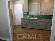 a view of wooden floor and cabinet
