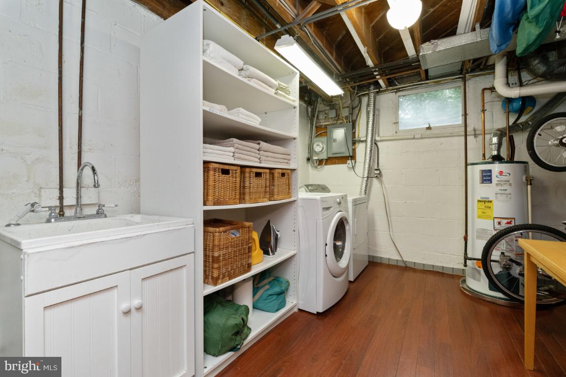 3917 Juniper Road Baltimore, MD 21218 - Photo 45 of 75 Lower level utility room Washer & Dryer convey