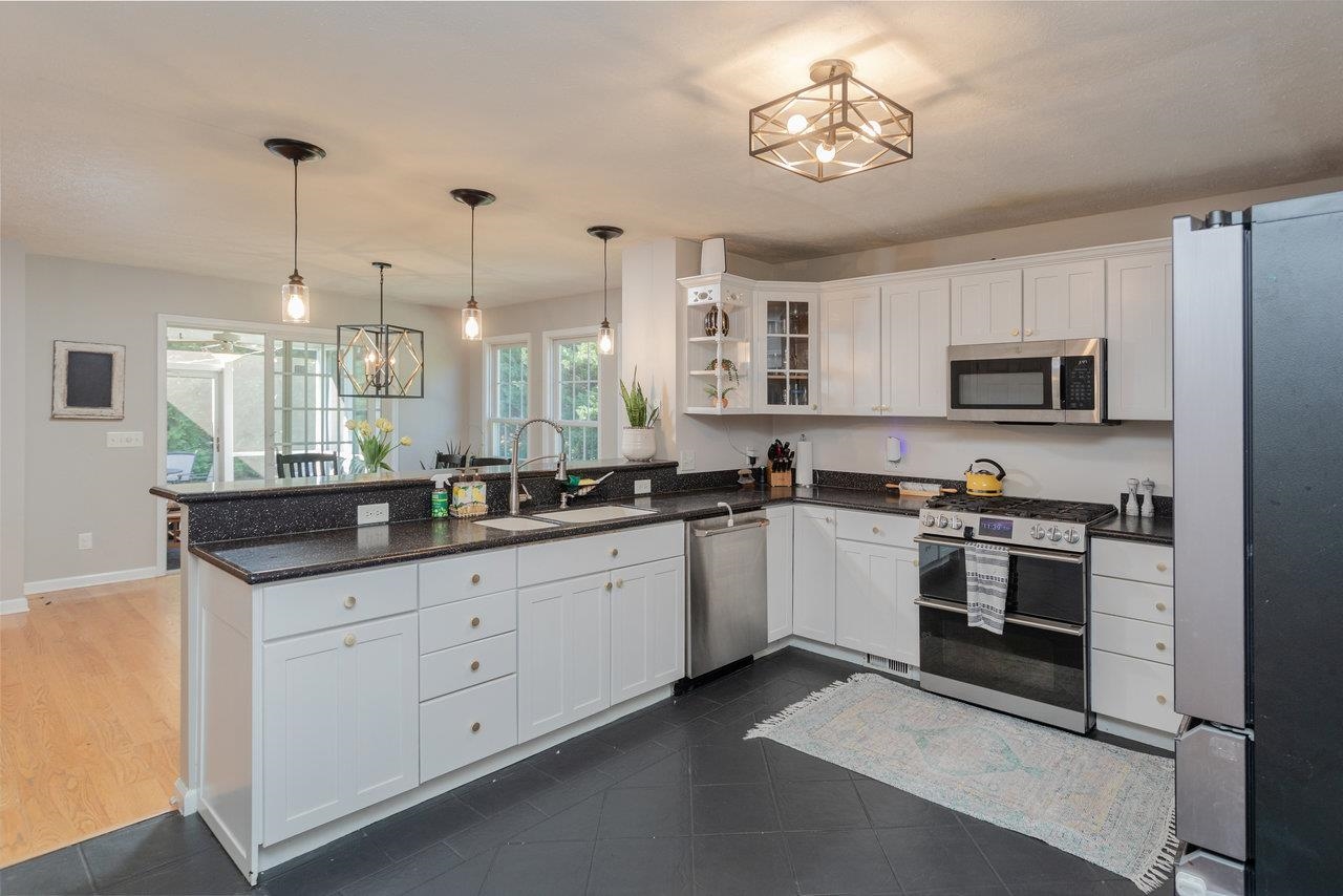 3750 Davis Road Penn Laird, VA 22846 - Photo 15 of 73 The kitchen has been updated throughout and offers white cabinets and lovely floors for a modern look.