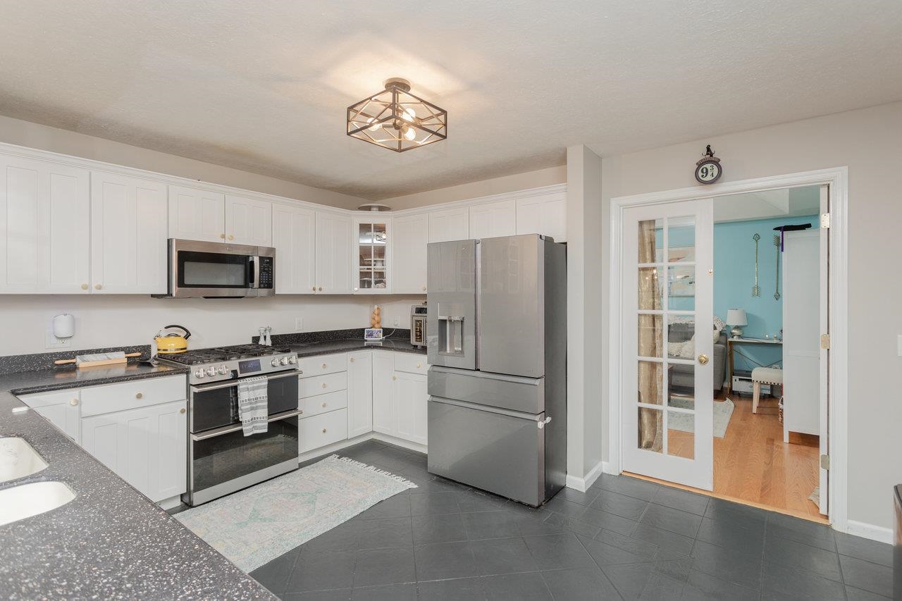3750 Davis Road Penn Laird, VA 22846 - Photo 17 of 73 a kitchen with stainless steel appliances granite countertop a refrigerator a stove a sink a microwave and a dining table