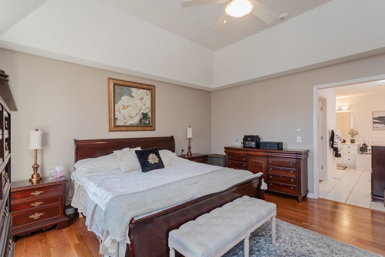 3750 Davis Road Penn Laird, VA 22846 - Photo 30 of 73 a bedroom with a bed and a dresser with wooden floor