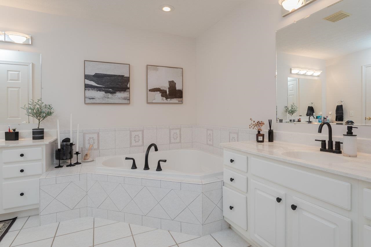 3750 Davis Road Penn Laird, VA 22846 - Photo 34 of 73 The primary bathroom offers double vanities, large soaking tub, tile floors and more.