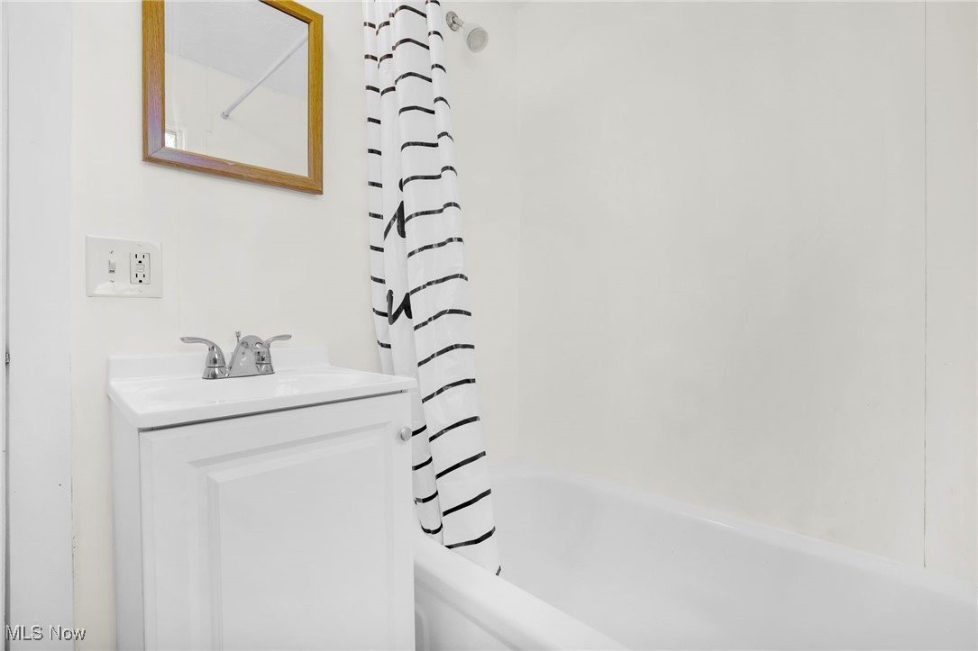 17 Ganyard Street Rittman, OH 44270 - Photo 11 of 16 Full bathroom with shower / bathtub combination with curtain and vanity