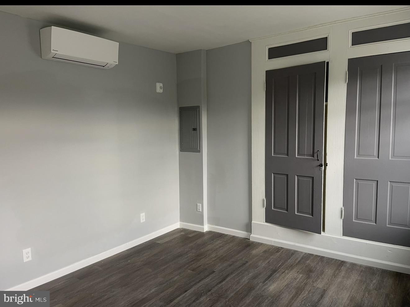 2045 North 8th Street, Unit 3 Philadelphia, PA 19122 - Photo 5 of 9 an empty room with wooden floor & windows