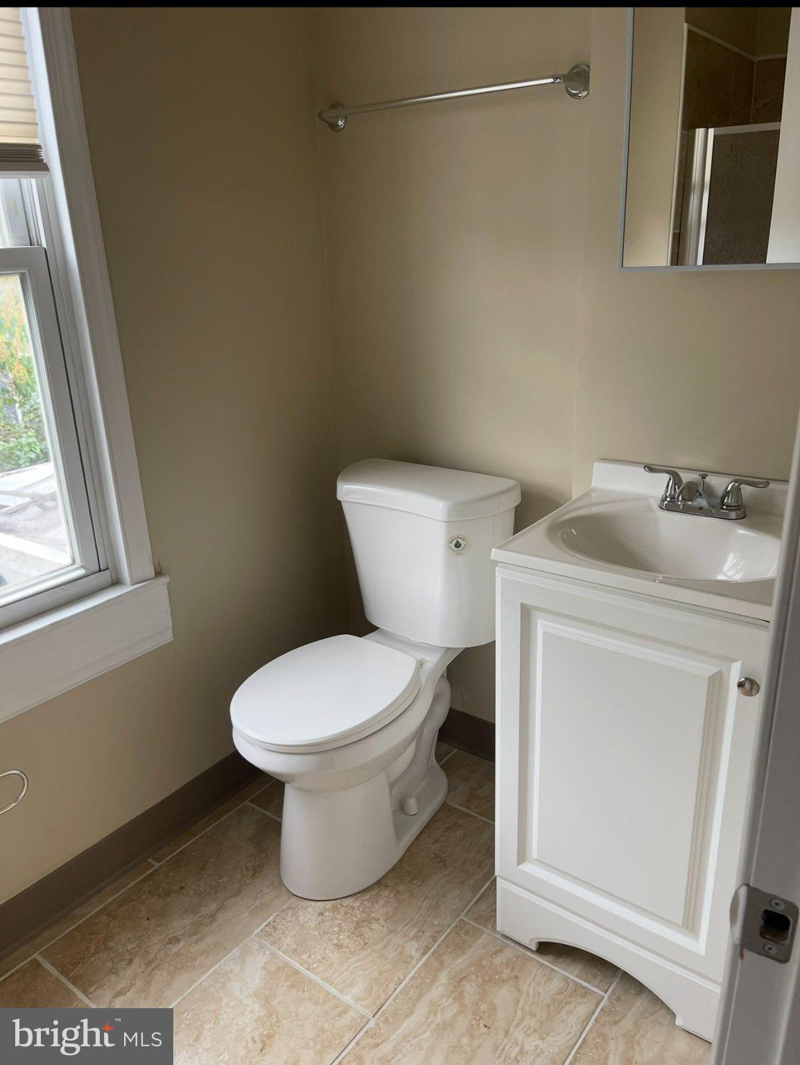 2045 North 8th Street, Unit 3 Philadelphia, PA 19122 - Photo 9 of 9 a white toilet sitting next to a bathroom sink
