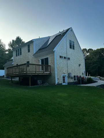 a view of a house with backyard