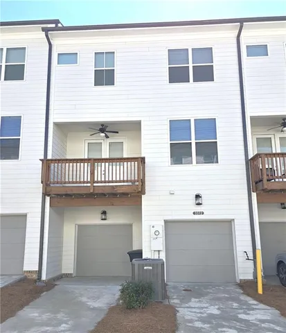 a view of a swimming pool with an outdoor seating
