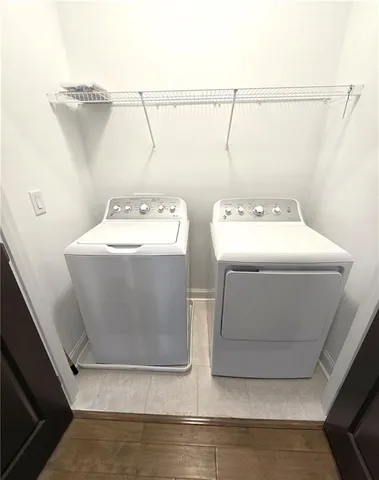 an empty room with closet and windows