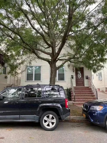 a car parked in front of a house