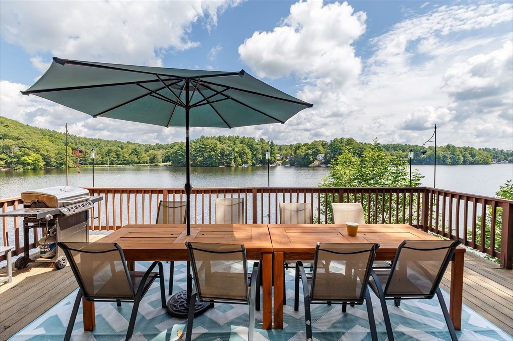53 Sandy Beach Road Holland, MA 01521 - Photo 11 of 40 a view of a chair and table on the terrace