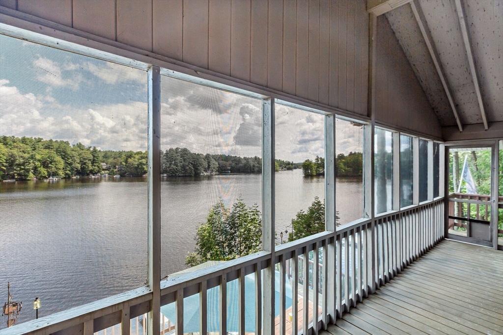 53 Sandy Beach Road Holland, MA 01521 - Photo 16 of 40 a view of a lake from a window