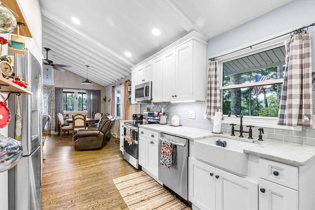 53 Sandy Beach Road Holland, MA 01521 - Photo 23 of 40 a kitchen with a sink appliances cabinets and furniture