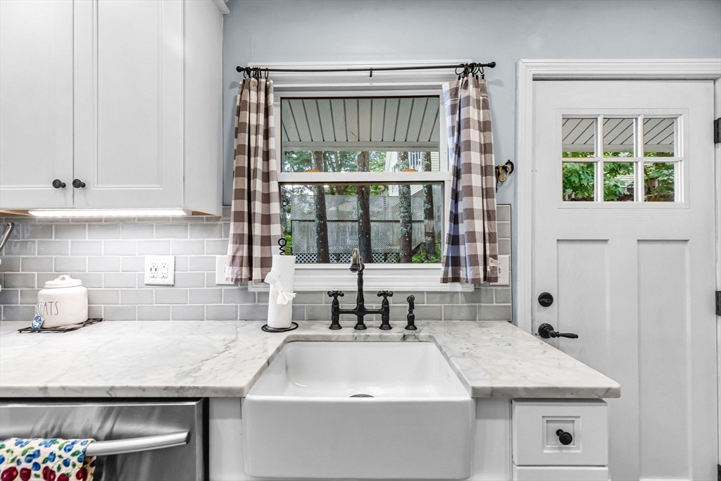 53 Sandy Beach Road Holland, MA 01521 - Photo 24 of 40 a kitchen with a sink and large window