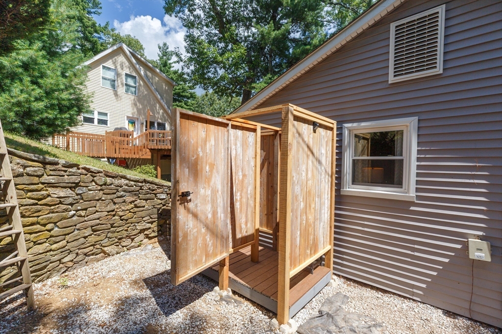 53 Sandy Beach Road Holland, MA 01521 - Photo 33 of 40 a view of a house with a yard