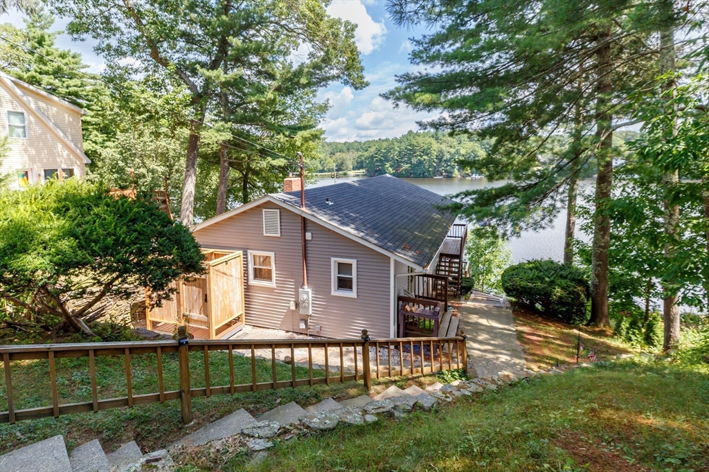 53 Sandy Beach Road Holland, MA 01521 - Photo 8 of 40 a front view of a house with a garden