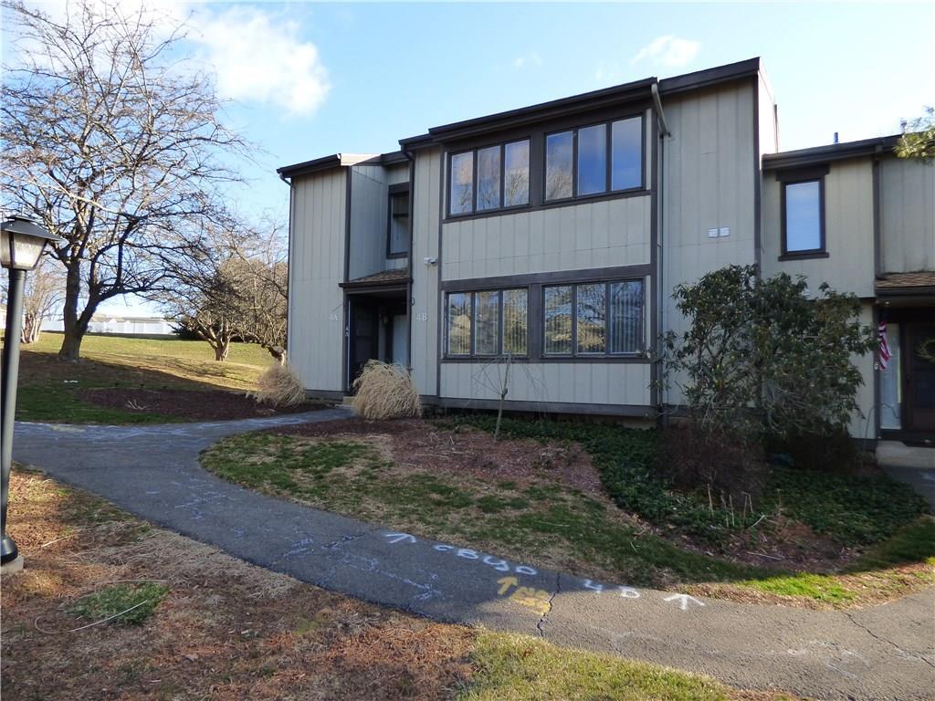 4 Pilgrims Harbor, Unit B Wallingford, CT 06492 - Photo 1 of 1 a front view of a house with garden