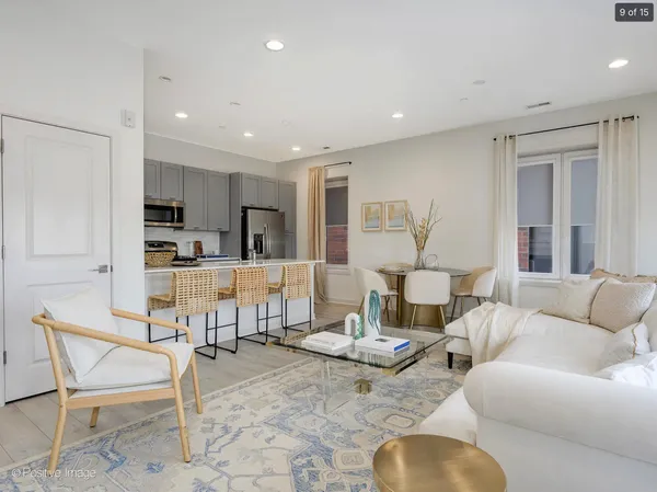 a living room with furniture and a table