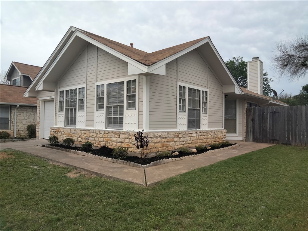 16813 Whitebrush Loop Austin, TX 78717 - Photo 1 of 1 a front view of a house with a yard