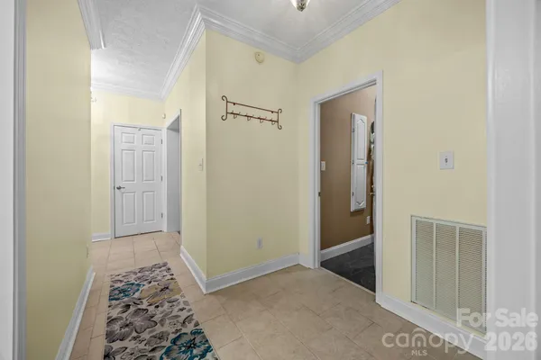 a view of hallway with bathroom