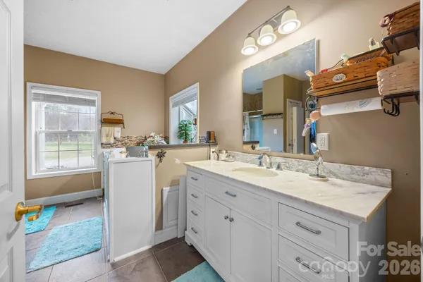a room with a sink cabinets and utility