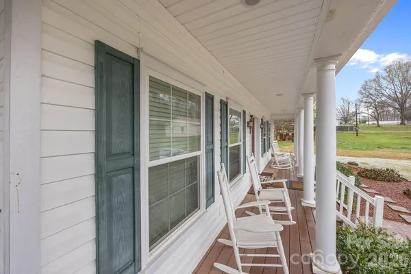 a view of a balcony with wooden floor