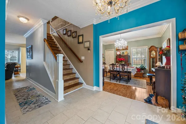 a view of a livingroom with furniture and stairs