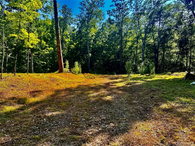 a swimming pool with an outdoor space and seating