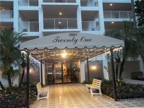 2661 South Course Drive, Unit 703 Pompano Beach, FL 33069 - Photo 1 of 11 a view of a building with entryway