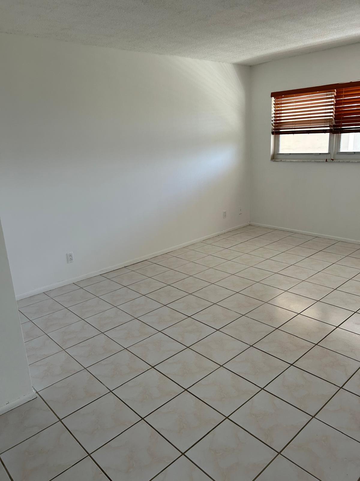2661 South Course Drive, Unit 703 Pompano Beach, FL 33069 - Photo 5 of 11 a view of a room and window