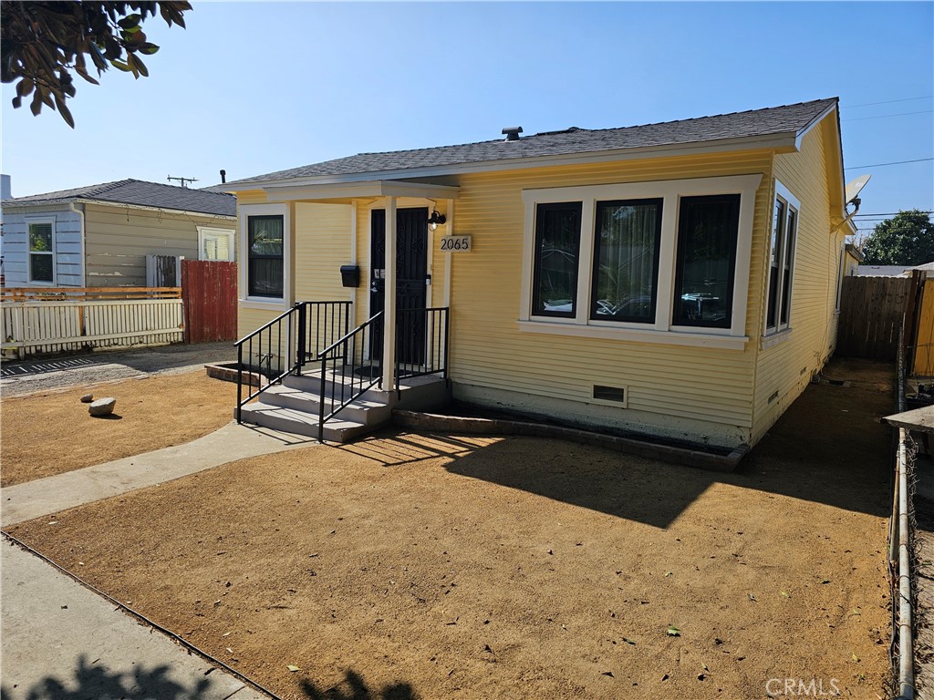 2065 Easy Avenue Long Beach, CA 90810 - Photo 1 of 1 a front view of a house