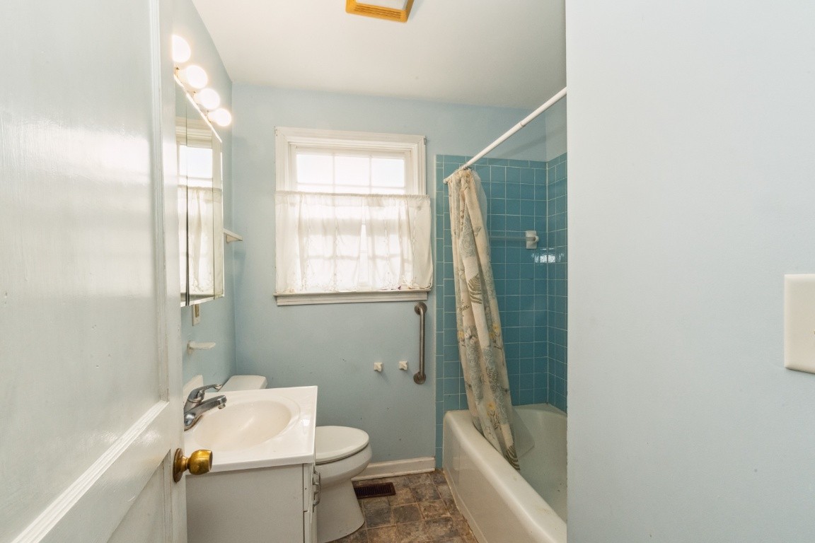1004 Neelys Bend Road Madison, TN 37115 - Photo 3 of 25 a bathroom with a sink a toilet and shower