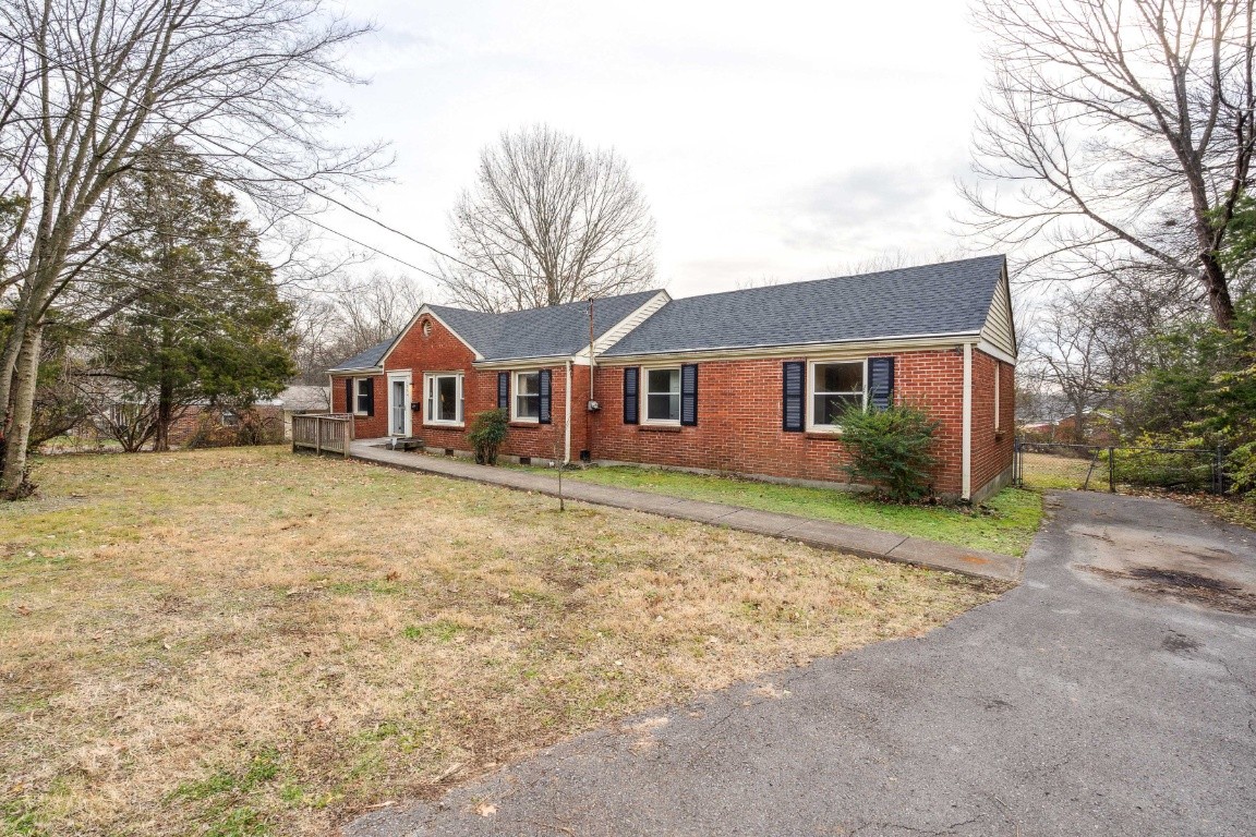 1004 Neelys Bend Road Madison, TN 37115 - Photo 6 of 25 a front view of a house with a yard