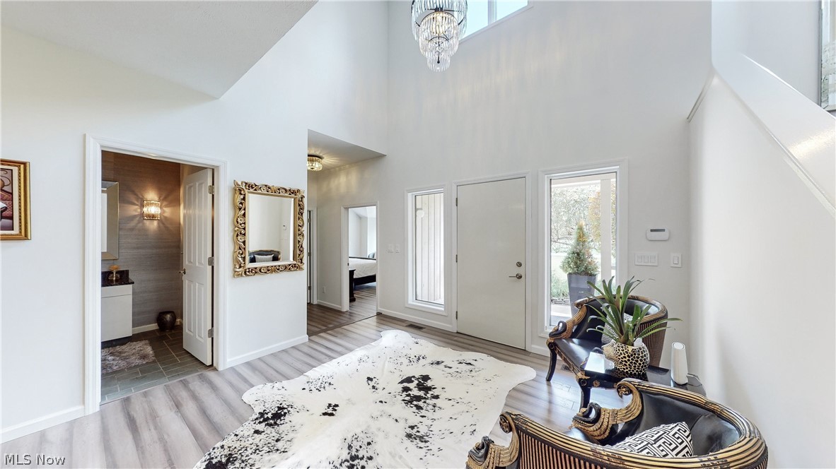 3700 Chagrin River Road Chagrin Falls, OH 44022 - Photo 25 of 43 Entrance foyer with an inviting chandelier, a high ceiling