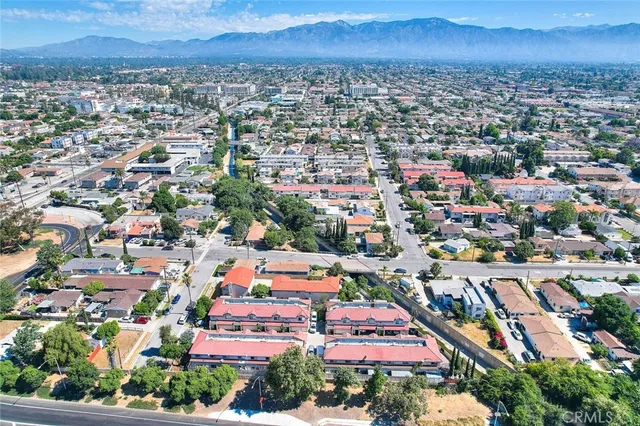 an aerial view of city and lake